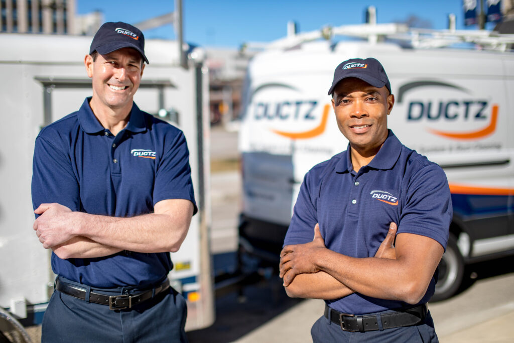 Closeup shot of two DUCTZ technicians.