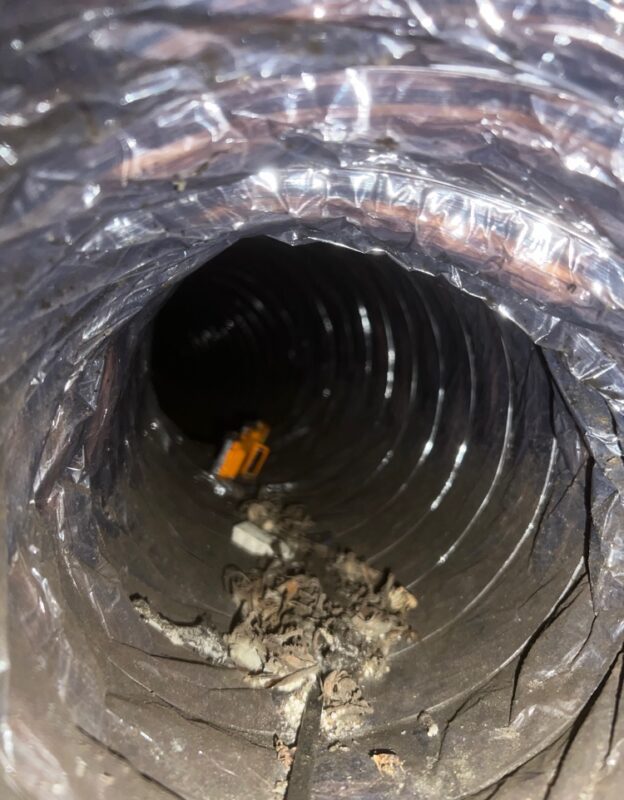 View of a dirty dryer duct interior