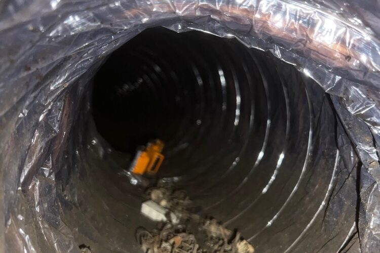 View of a dirty dryer duct interior