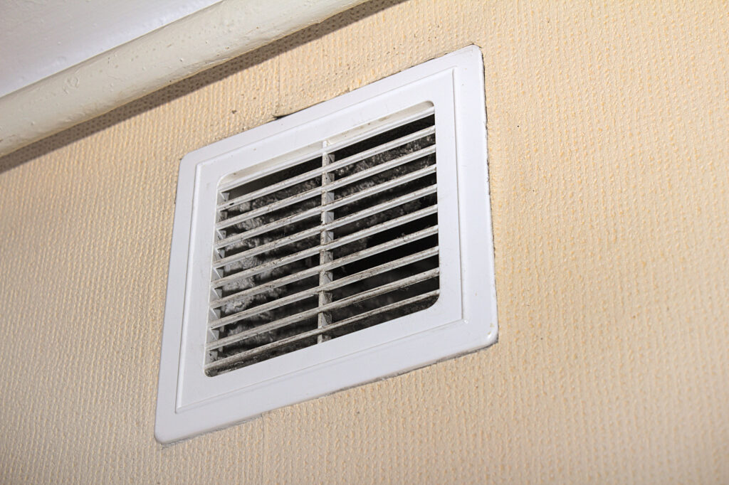 view of a dirty residential home air vent.